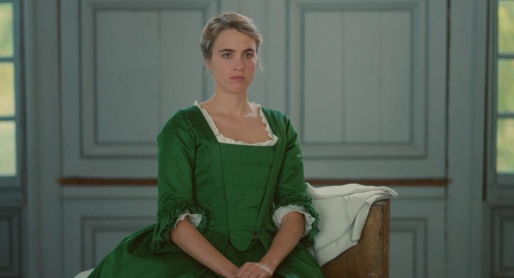 Héloïse wearing a green dress in Portrait of a Lady on Fire